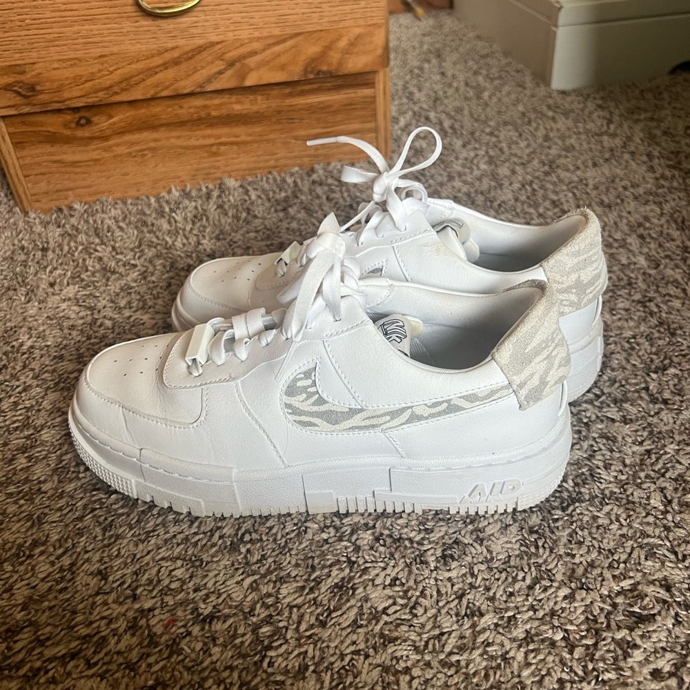 Nike White and Gray Sneakers with Iconic Air Force 1 Design